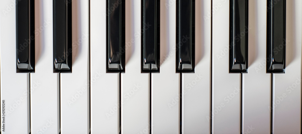 piano keys background illuminated on the left piano keys background illuminated on the left
