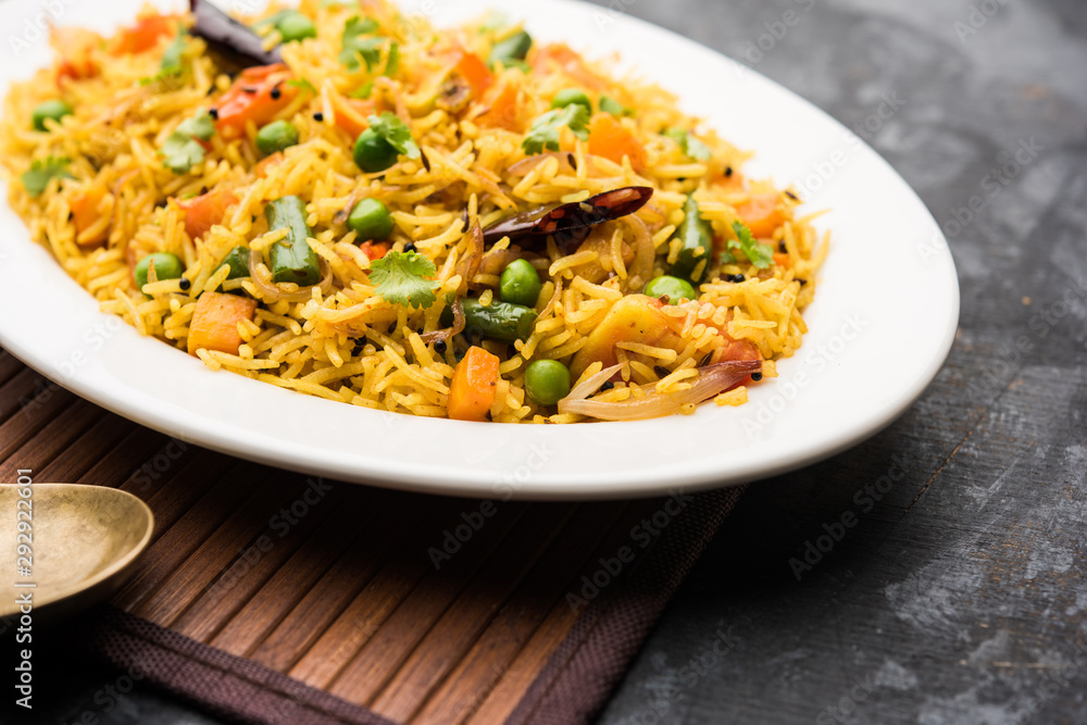 Tawa Pulao/Pulav/Pilaf/Pilau is an Indian Street Food made using basmati rice, vegetables and spices. Selective focus Tawa Pulao/Pulav/Pilaf/Pilau is an Indian Street Food made using basmati rice, vegetables and spices. Selective focus