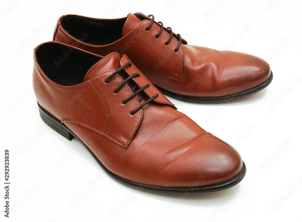 pair of brown leather shoes isolated on white background pair of brown leather shoes isolated on white background