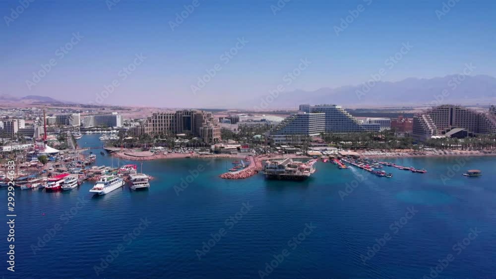 Eilat Shorline with Marina Boats Hotels and landscape Aerial Drone footage over Eilat shoreline With Marina boats And hotels in the summer Eilat Shorline with Marina Boats Hotels and landscape Aerial Drone footage over Eilat shoreline With Marina boats And hotels in the summer