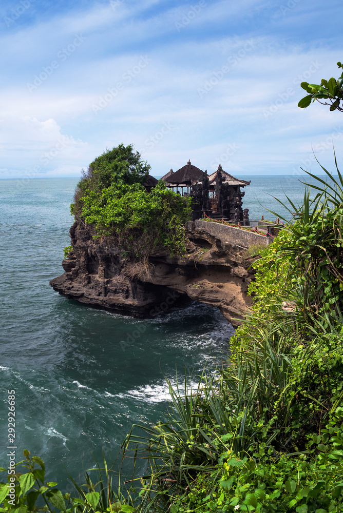 Tanah Lot temple sits o a large offshore rock in Beraban, Bali, Indonesia