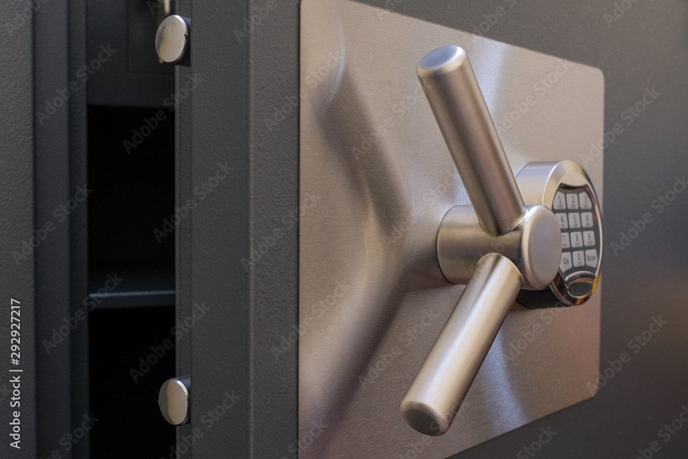 Open door of a safe with a digital code lock. - obrazy, fototapety, plakaty 