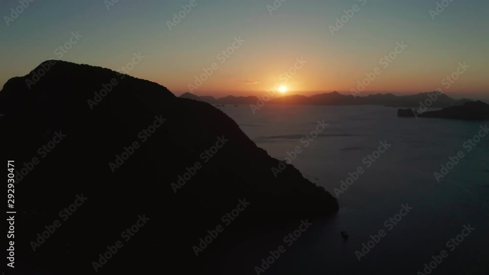 Aerial drone seascape with mountains and rocky islands in the morning time El Nido. sunset over the sea. tropical bay in at sunset. Sunset sky and mountains rocks of bay. Dreamy sunset among the rocks Aerial drone seascape with mountains and rocky islands in the morning time El Nido. sunset over the sea. tropical bay in at sunset. Sunset sky and mountains rocks of bay. Dreamy sunset among the rocks