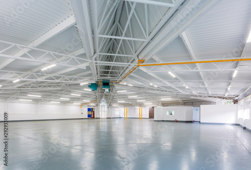An interior of a large, empty warehouse