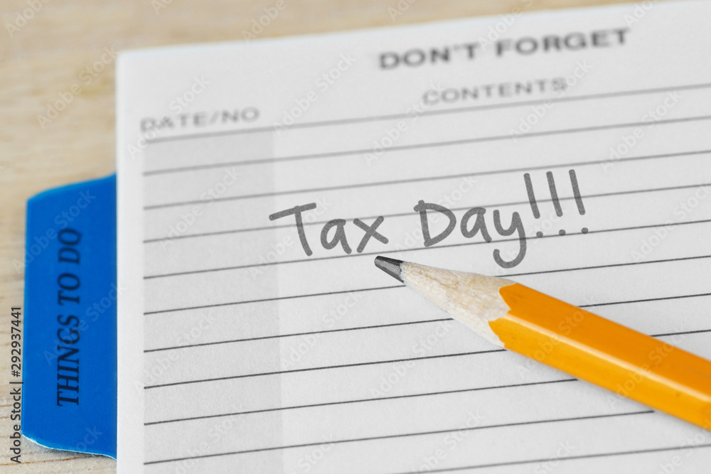 The words Tax Day written into an agenda - Tax payment concept The words Tax Day written into an agenda - Tax payment concept