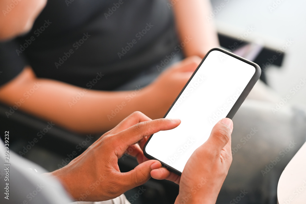 Communication smartphone on man hands with empty screen clipping path.