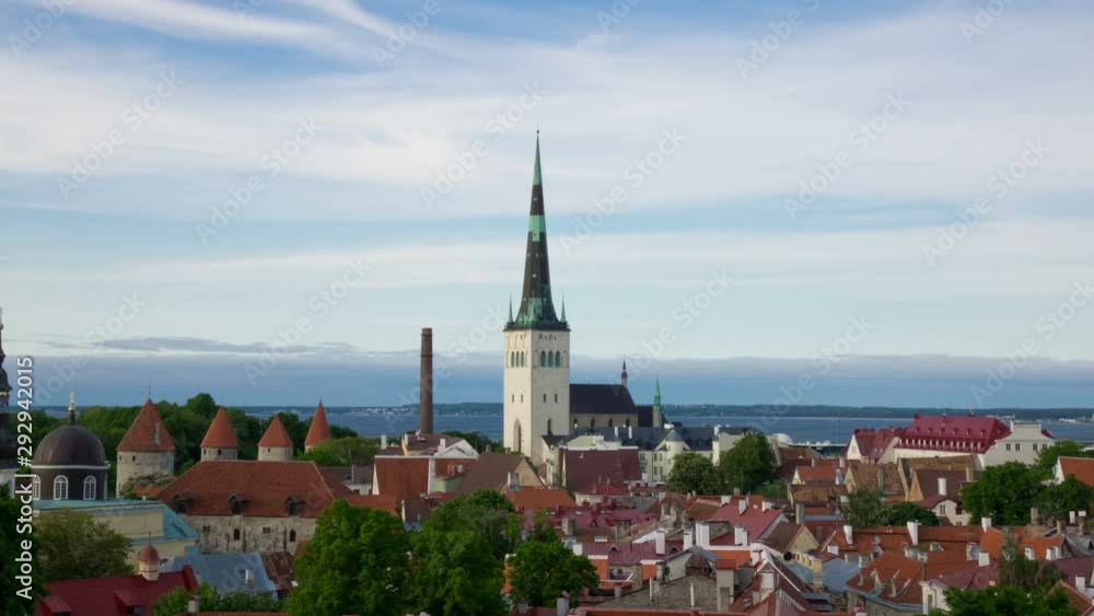 Time lapse, clouds over the sea.City panorama from an observation deck of Old city spikes of churches and ancient towers. Tallinn. Estonia Time lapse, clouds over the sea.City panorama from an observation deck of Old city spikes of churches and ancient towers. Tallinn. Estonia