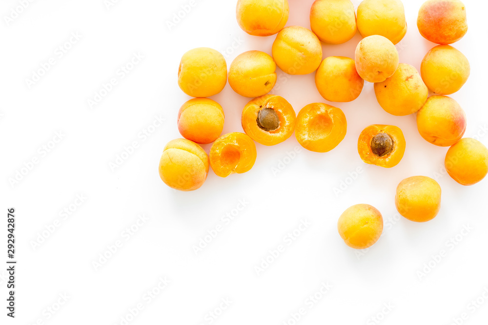Fruit background with apricots on white background top view copy space