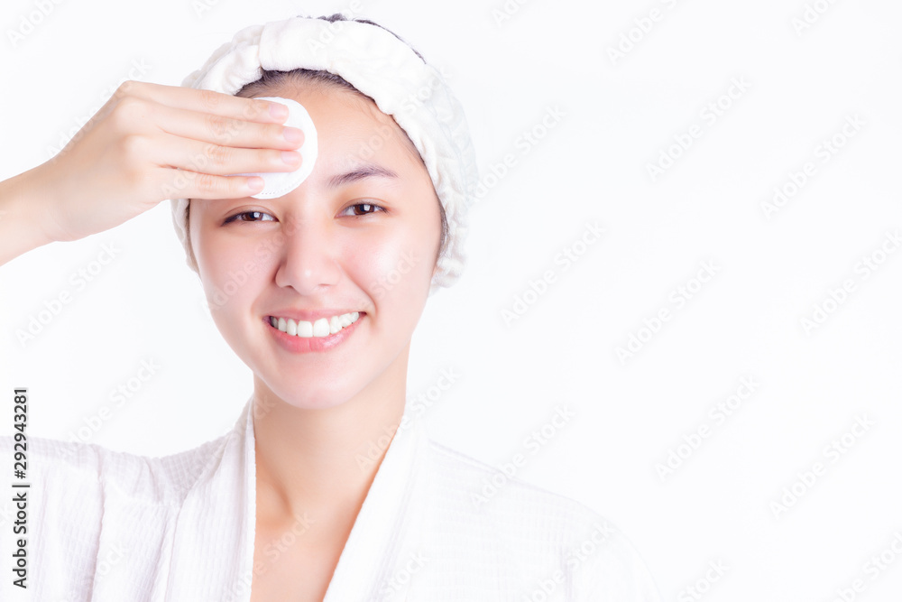 Healthy young asian woman removing makeup from her face and cleaning face by using cotton pad. Beauty woman use pure cotton pad after bath. isolated on white background. skin care, beauty concepts. Healthy young asian woman removing makeup from her face and cleaning face by using cotton pad. Beauty woman use pure cotton pad after bath. isolated on white background. skin care, beauty concepts.