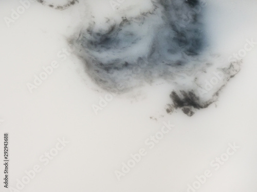 Marble texture, The smooth polished white marble surface has a black pattern of stone on the background.