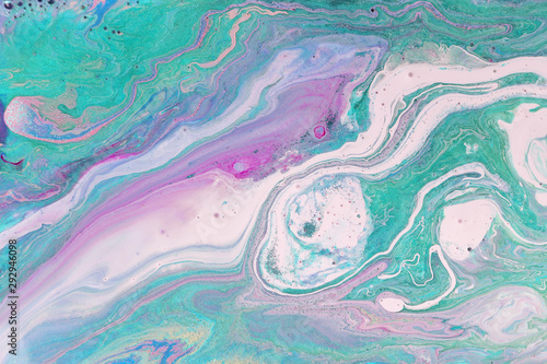 Purple pastel marble pattern with green glitter. Abstract liquid background