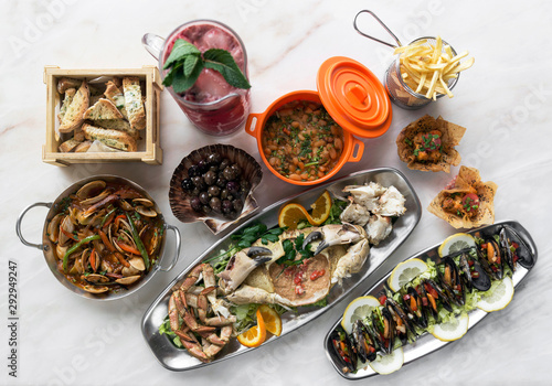 mixed fresh portuguese gourmet seafood set on white table photo