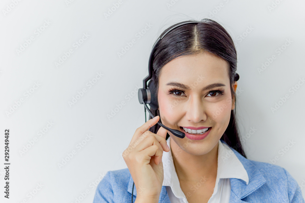 Business call center customer support - Beautiful Asian female staff operator wearing headphone with microphone on white background. Business call center customer support - Beautiful Asian female staff operator wearing headphone with microphone on white background.