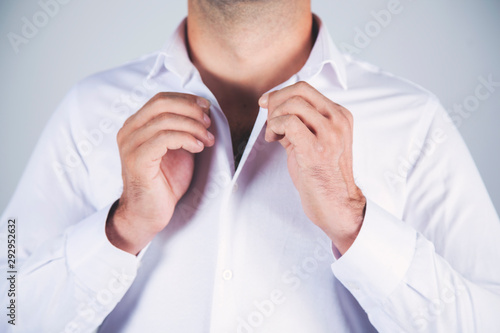man hand shirt buttons