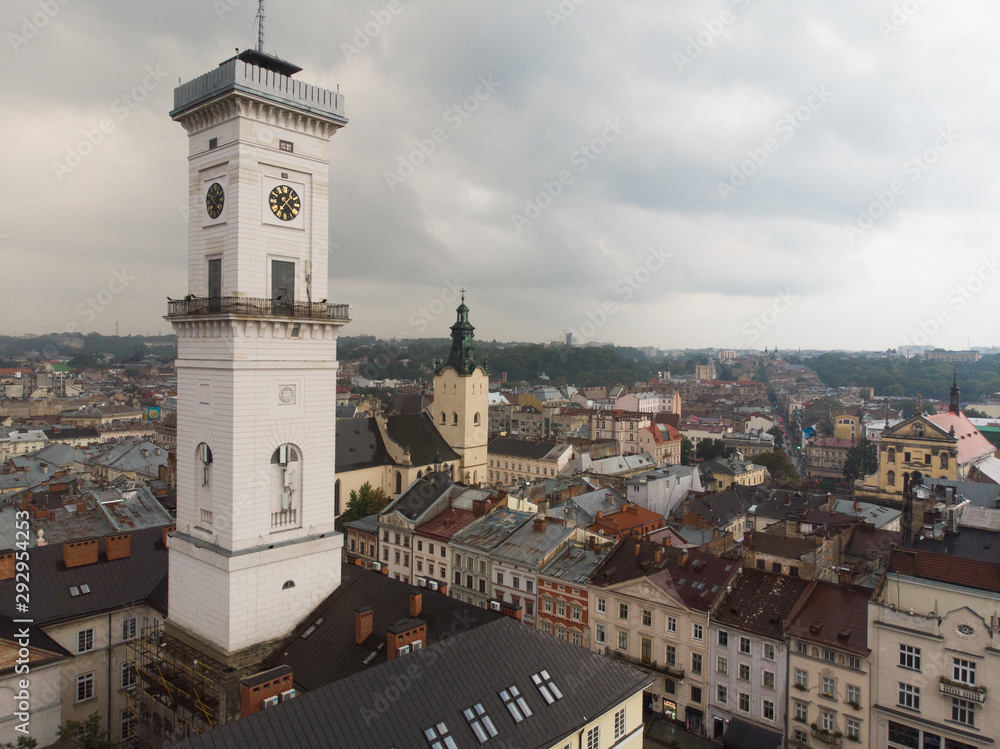 aerial view of european central square with bell tower overcast rainy weather