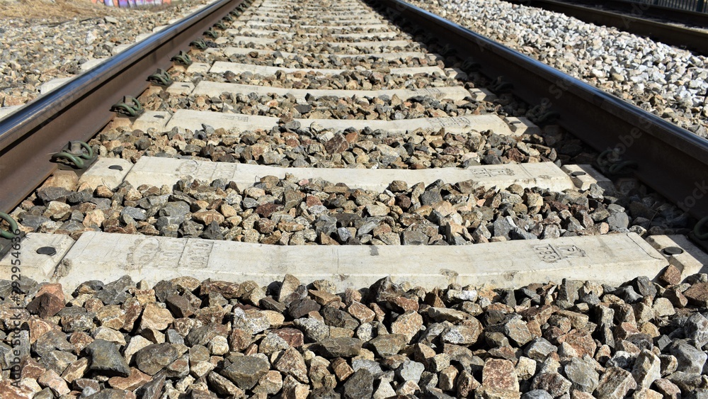 Close-up of the ballast and the sleepers of the train tracks Close-up of the ballast and the sleepers of the train tracks