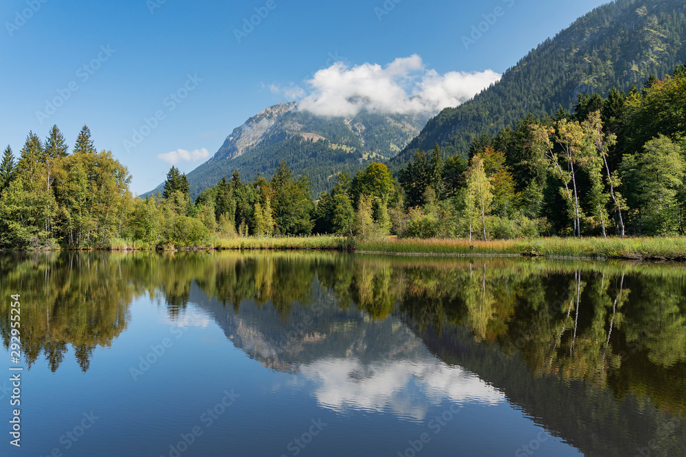 Oberstdorf - View to Lake Moorweiher with Nebelhorn mountain reflected on the water / Bavaria / Germany