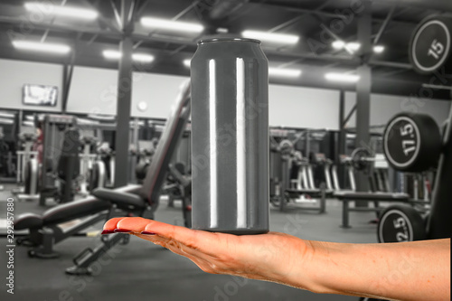 Gym interior and woman hand with product. Free space for your decoration. 