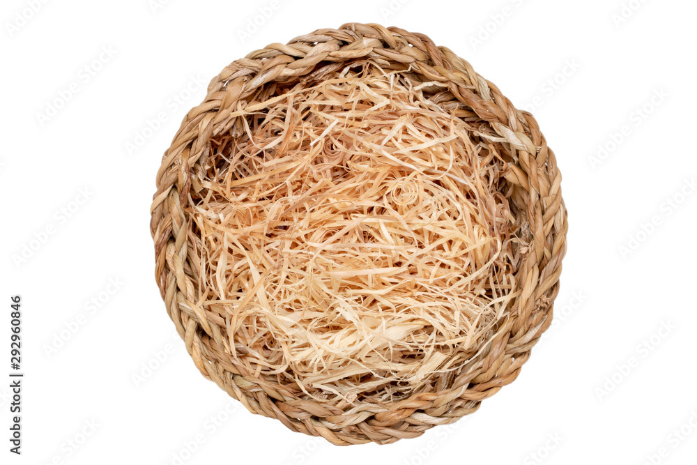 Empty basket. Close-up of a empty basket filled with decorative straw isolated on a white background. For your food and product display montage. Top view. Macro. Empty basket. Close-up of a empty basket filled with decorative straw isolated on a white background. For your food and product display montage. Top view. Macro.