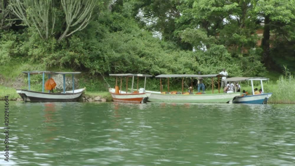 Local people are busy in a little African harbour on lake Kivu Local people are busy in a little African harbour on lake Kivu