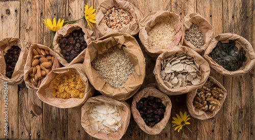 Mix of cereals and porridge, nuts and seeds for breakfast. Top view. Bio healthy nutrition products