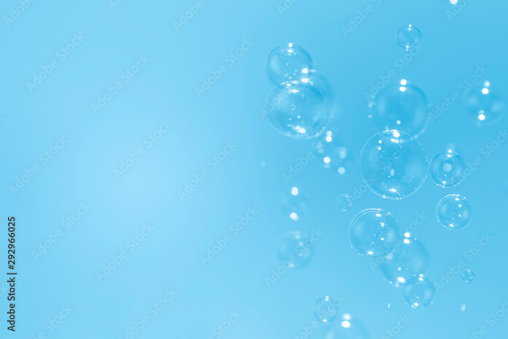 beautiful soap bubbles floating on a blue background