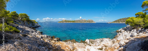 Summer sunny day beautiful view from the coast of Agistri island to the Dorousa island, Aponissos bay, Saronic Gulf, Greece. photo