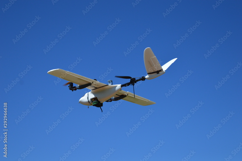 Hybrid drone flying in a cloudless day of blue sky Hybrid drone flying in a cloudless day of blue sky