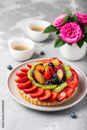 Tart with strawberries  kiwi  plums and cream