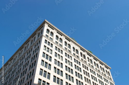 older nyc building with blue sky