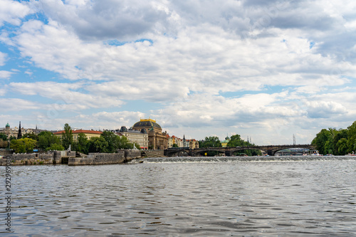 Scenic panorama cityscape view of Moldava river boat Prague in Czech Republic.