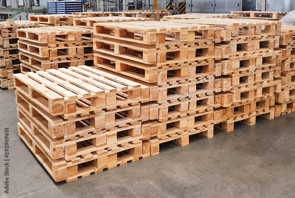 Wooden pallets in the production warehouse Wooden pallets in the production warehouse