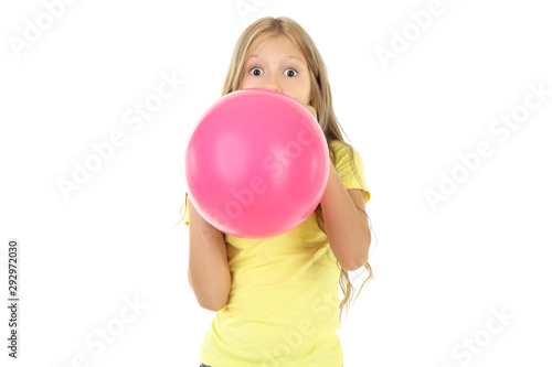 Pretty little girl blowing pink balloon on white background