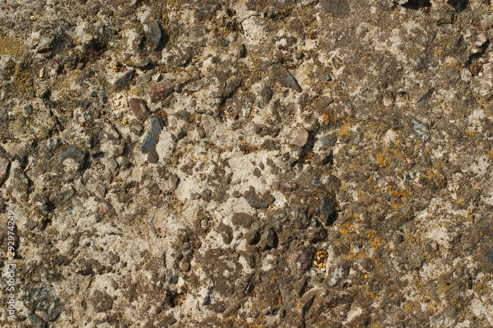 A texture of cracked paint on a concrete wall A texture of cracked paint on a concrete wall