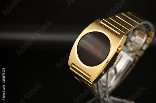 LED gold digital watch vintage retro wristwatch with red display 70s 80s isolated alarm multifunctional chronograph scratched steel used made in usa rare worn watch Armbanduhr golden luxurious side  photo