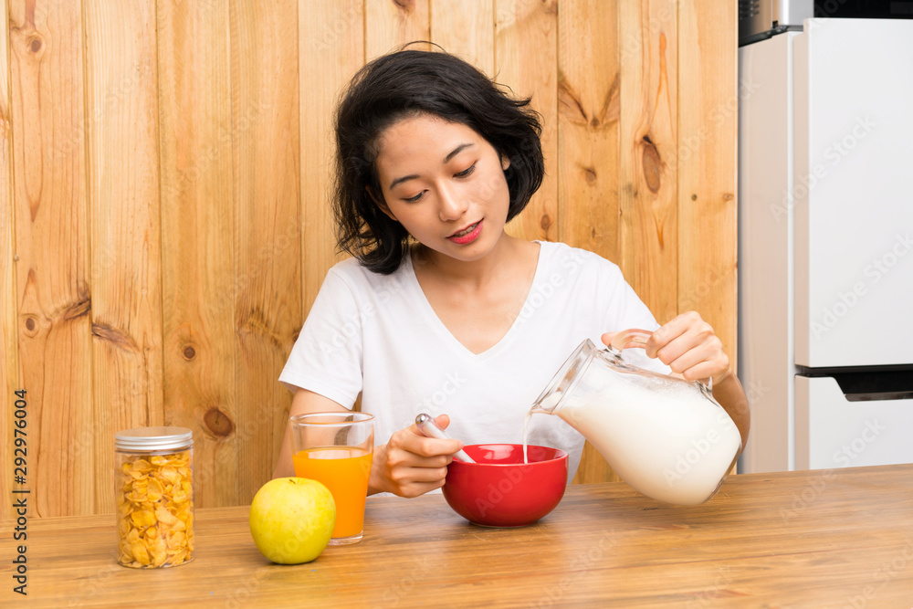 Asian young woman having breakfast Asian young woman having breakfast