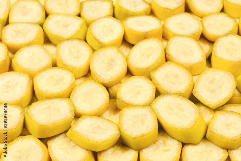 Fresh banana slices background. Top view.