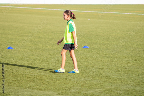 Little girl in a soccer training