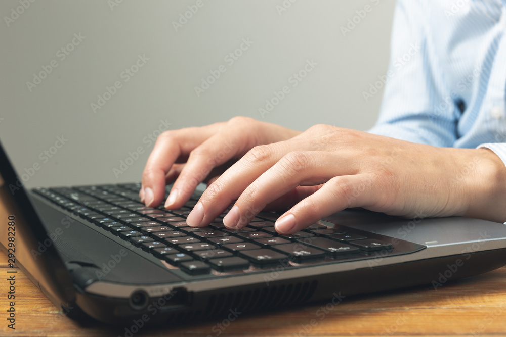 Businesswoman's hands typing on laptop keybord. Businesswoman's hands typing on laptop keybord.