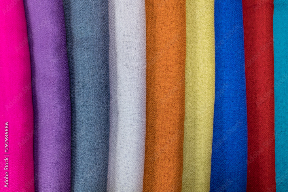 Set of colored cashmere scarves. Bright colours. Fashionable colors for this season. Modern fabric.