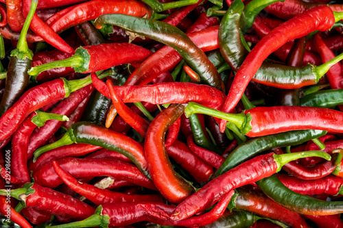 Close up background. Group of red chillies for sale in the organic products market of Le  n. Spain