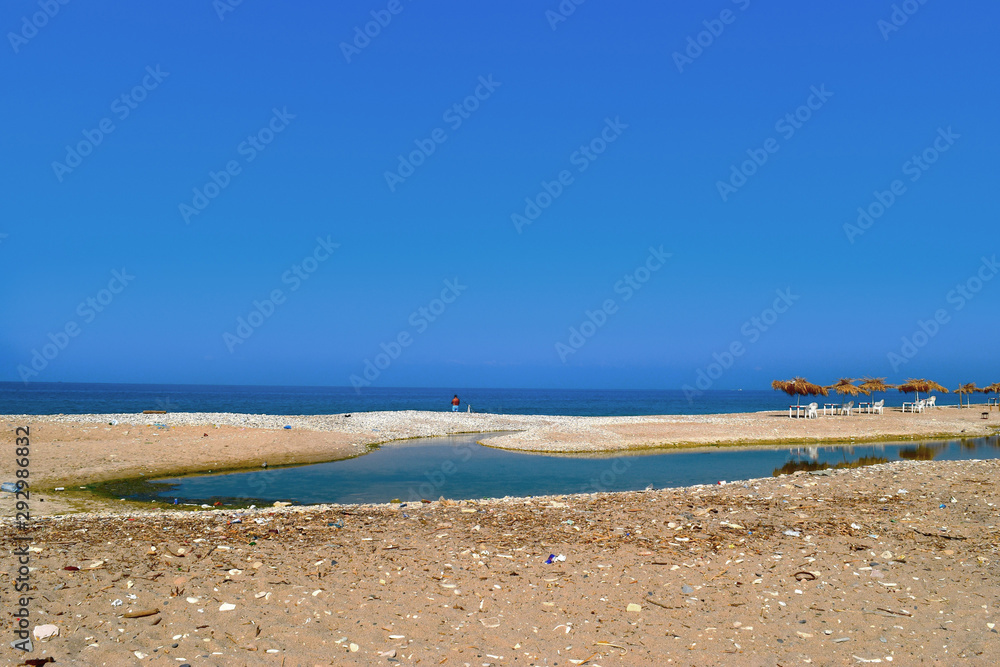 River Nahr Ibrahim estuary getting dry at the end of the summer, Lebanon, with horizon over the sea