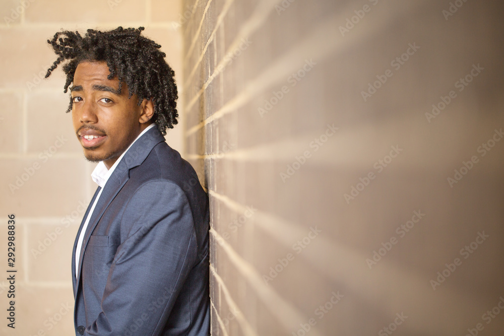 Young handsome African American man smiling outside. Young handsome African American man smiling outside.