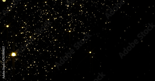 Golden glitter rain and gold particles splash. Golden sparks shimmer glow flow with bokeh light on luxury black space background