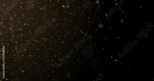 Golden glitter rain and gold particles glow with bokeh light. Golden sparks splash, shimmer glow flow on luxury black space background