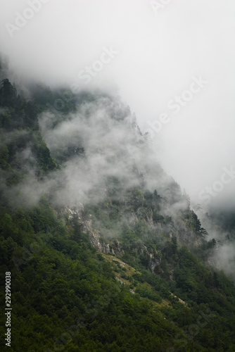 Clouds rising from mountain...