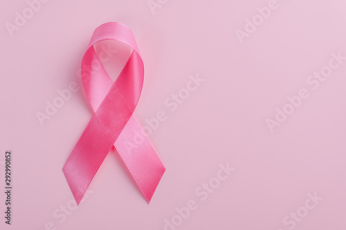 Pink ribbon on pink background. Breast Cancer Awareness Month concept