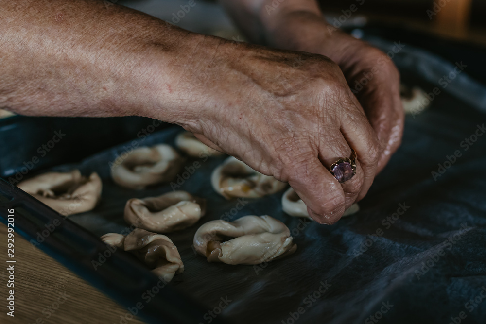 hands cooking making donuts or traditional sweets