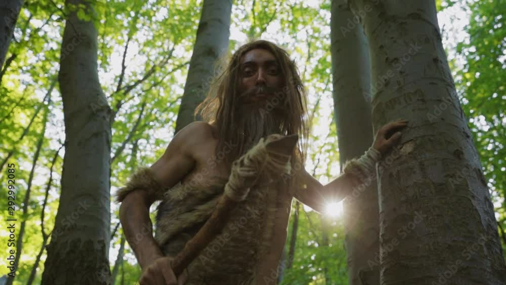Caveman of neanderthals homo sapiens with survival spear exploring ...