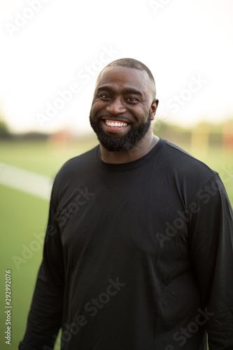 Portrait of an African American Football coach smiling. © digitalskillet1